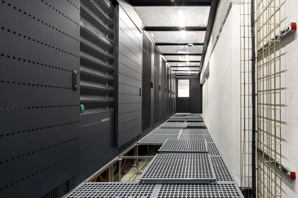Perforated raised floor panels in data center server room